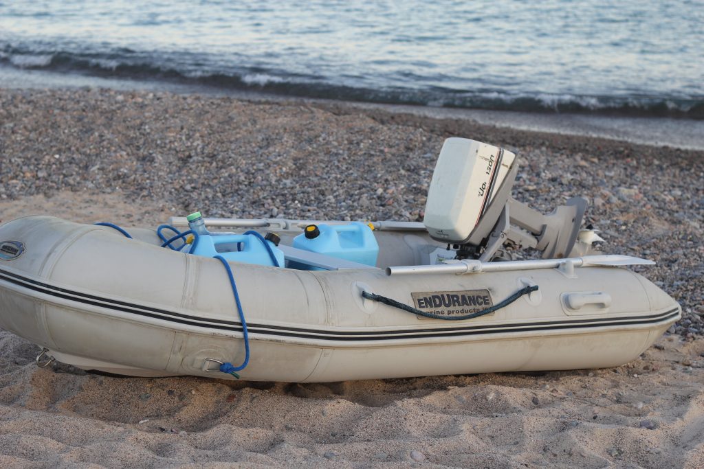transporting fresh water in blue jugs with a dinghy