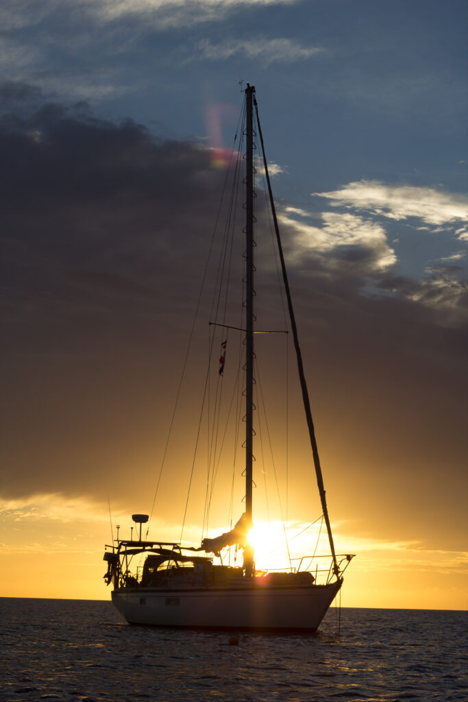 Sailboat anchored with sunset