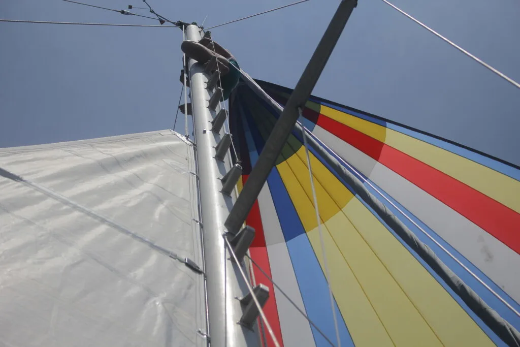 downwind sailing with a colorful spinnaker and mainsail