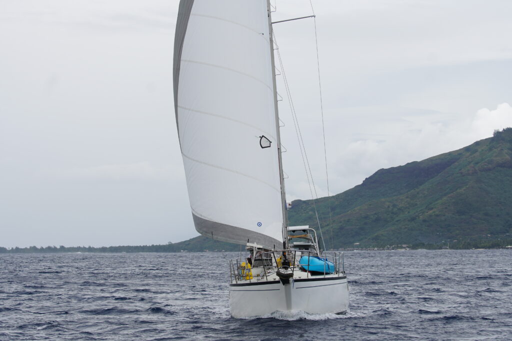 Sailboat sailing under white headsail