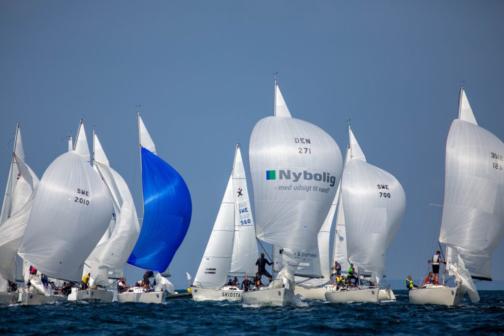 sailing race with boats flying symmetrical spinnakers